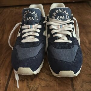 Navy women’s size 8 New Balance. These adorable shoes have never been worn.